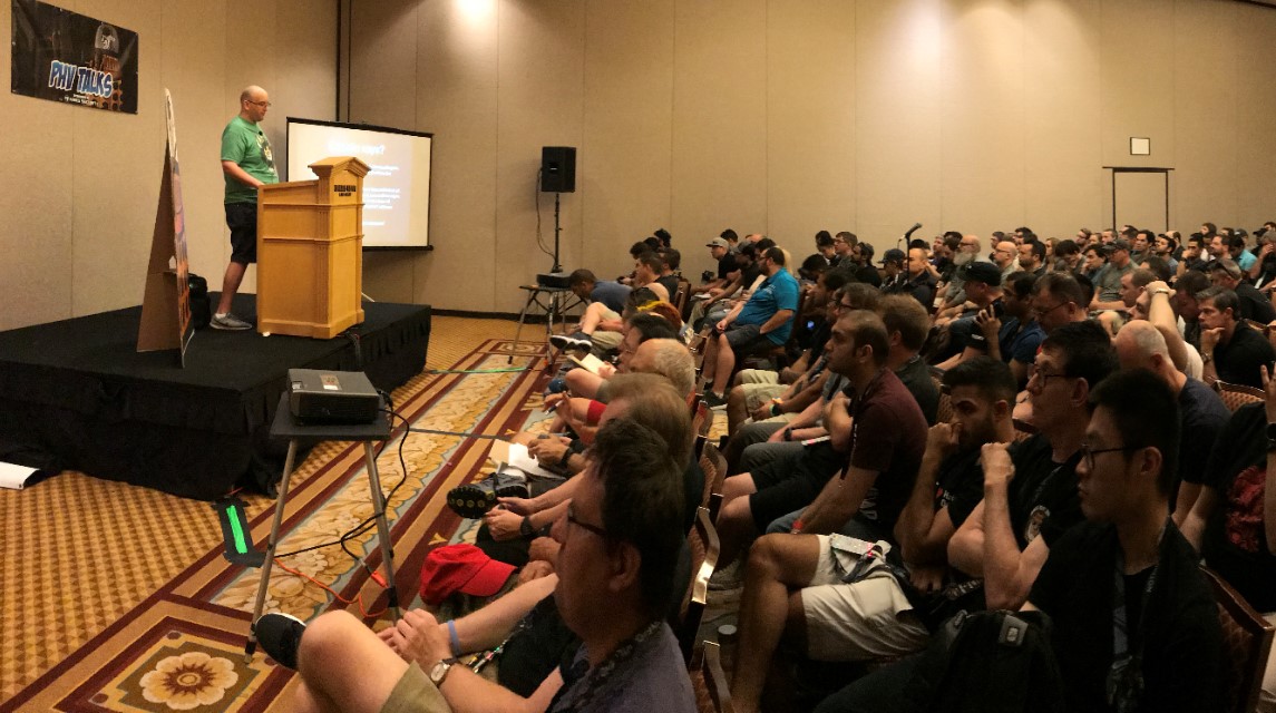 DEF CON attendees listen to a talk at the Packet Hacking Village.