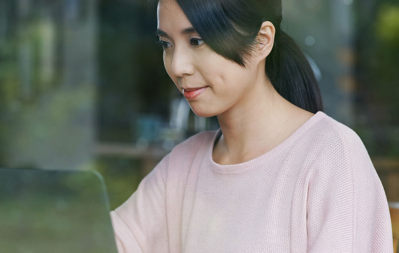 Woman using a laptop computer.